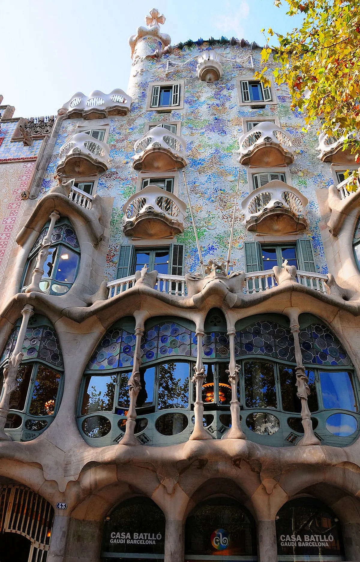 The wavy facade of Casa Batlló decorated with colourful tiles