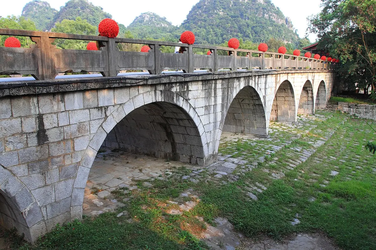 The old multi-arch stone Flower Bridge in the Seven Star Scenic Area.