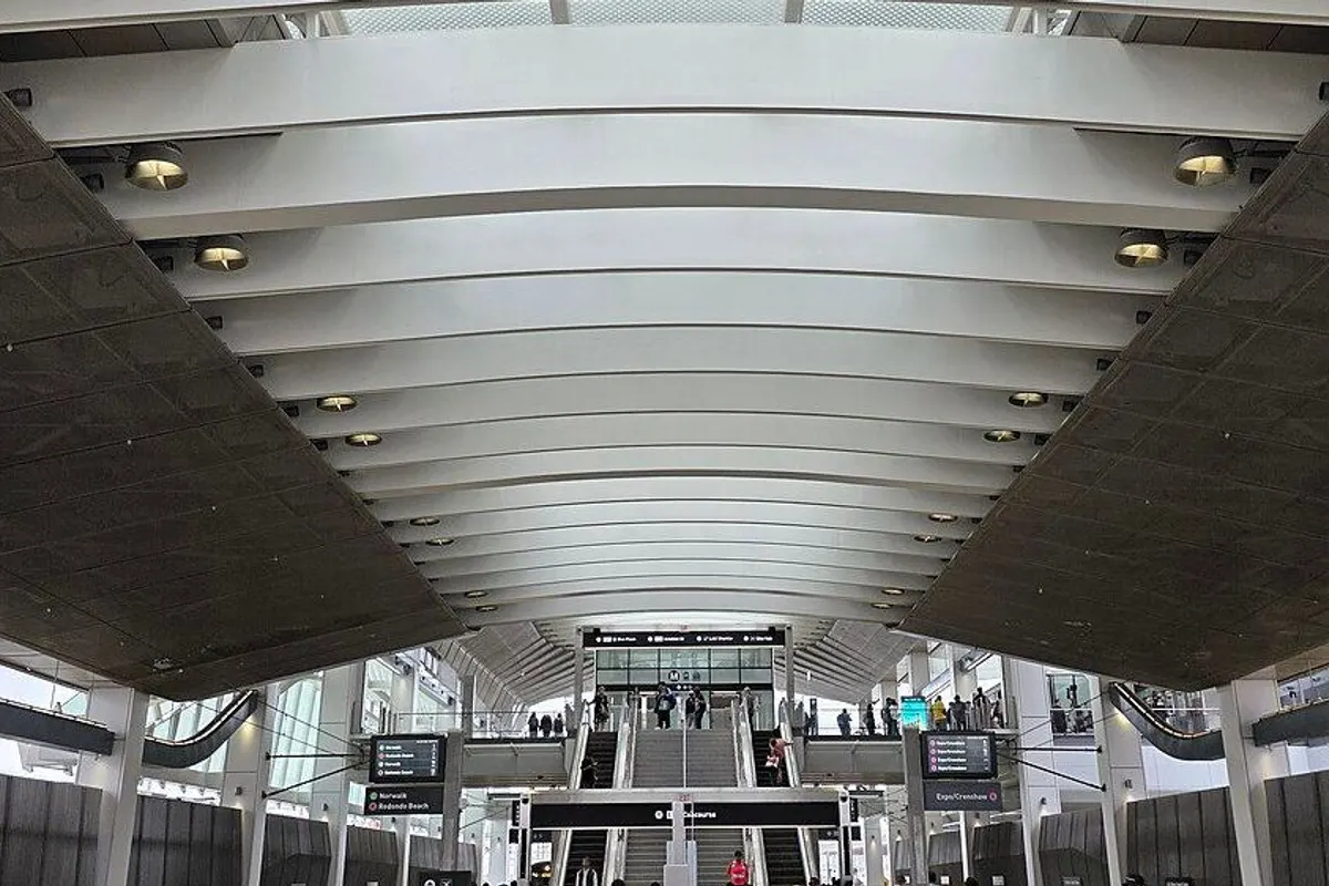 The long platform of LAX/Metro Transit Center station under a white arched roof.