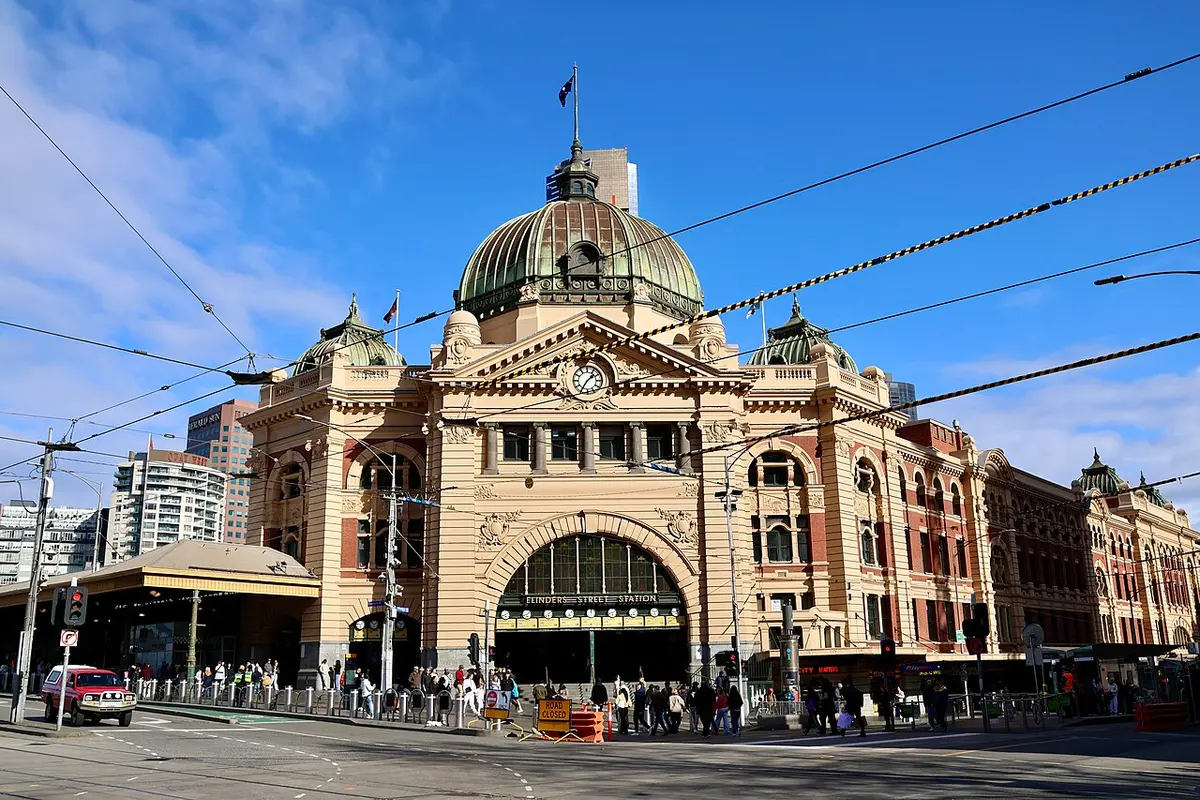 The yellow facade and dome of Flinders Street Station in daylight